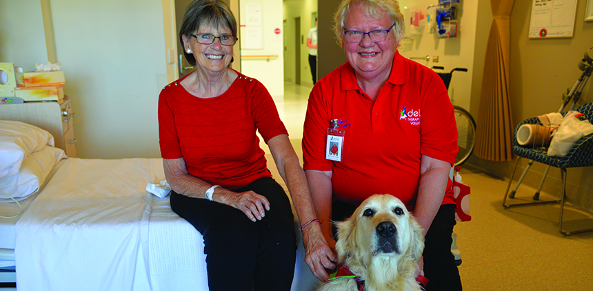 Patient Lesley Imber with Golden Retriever Angel and owner Mary Tuohey.